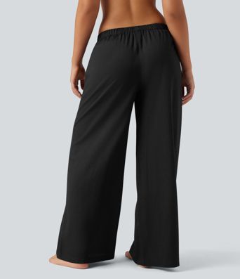 Pantalones holgados de cintura alta estilo resort con bolsillos