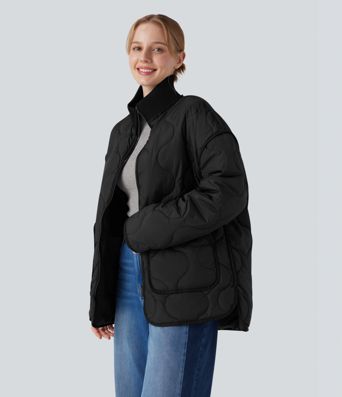 Veste matelassée décontractée zippée à col montant, manches longues et poches.