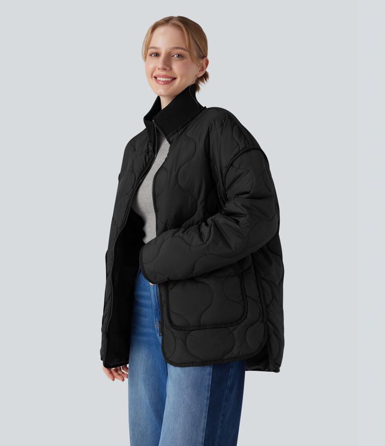 Veste matelassée décontractée zippée à col montant, manches longues et poches.