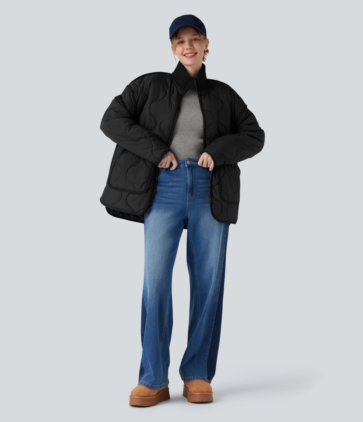 Veste matelassée décontractée zippée à col montant, manches longues et poches.