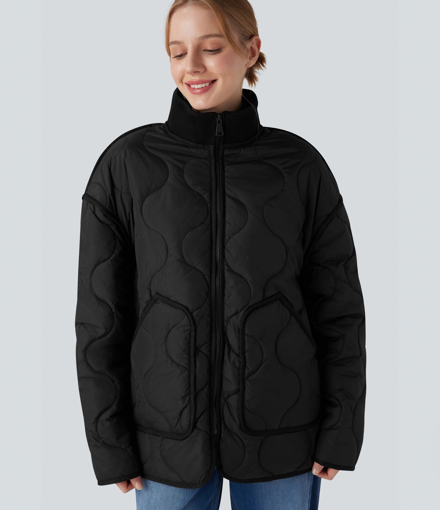 Veste matelassée décontractée zippée à col montant, manches longues et poches.