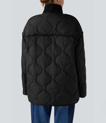 Veste matelassée décontractée zippée à col montant, manches longues et poches.
