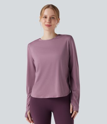 Rygglös, korslagd långärmad yoga- och träningsstopp med tumhål