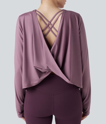 Rygglös, korslagd långärmad yoga- och träningsstopp med tumhål