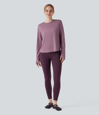 Rygglös, korslagd långärmad yoga- och träningsstopp med tumhål