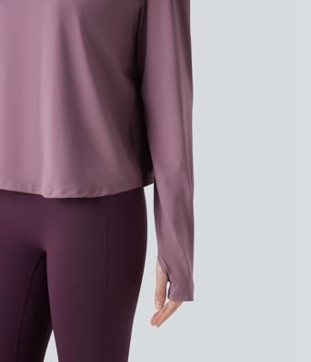 Rygglös, korslagd långärmad yoga- och träningsstopp med tumhål