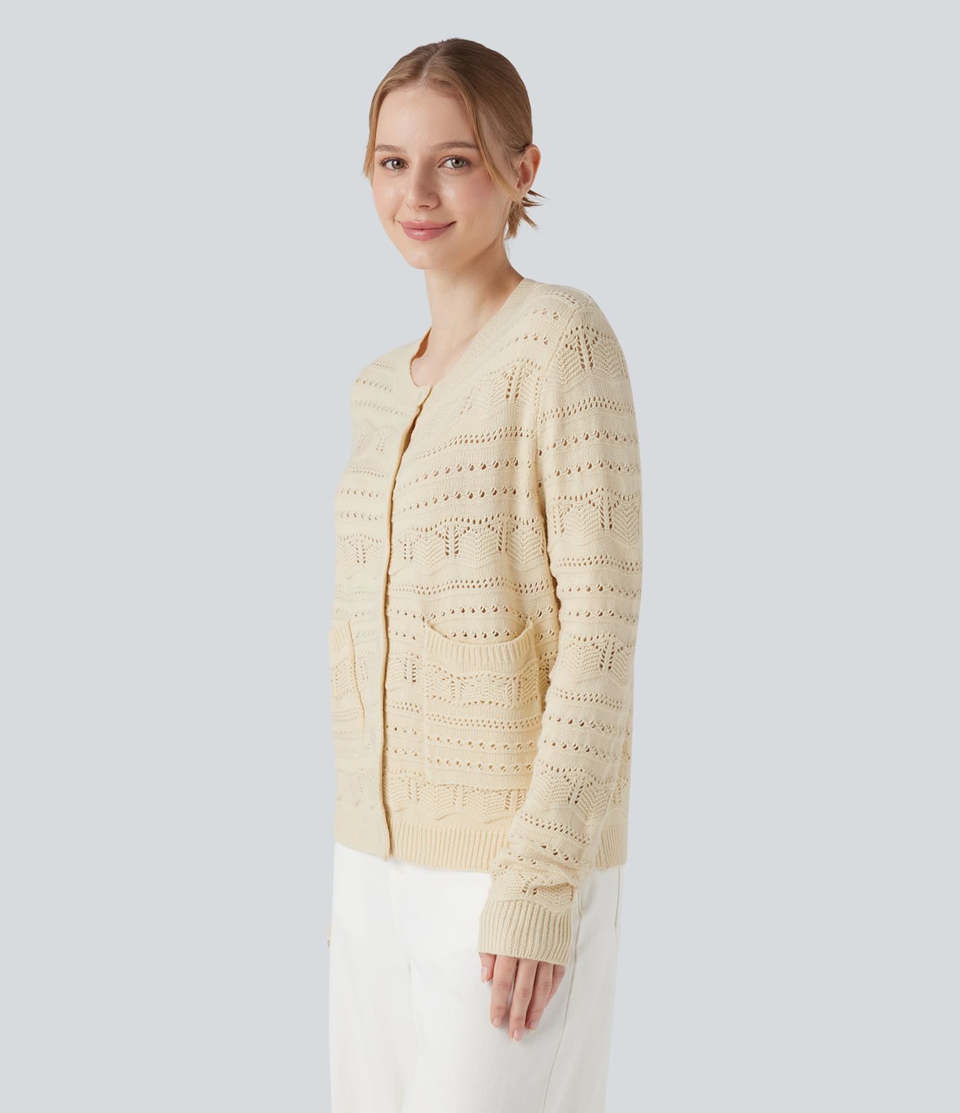 Cardigan de travail col rond à manches longues avec boutonnage et découpes avec poches
