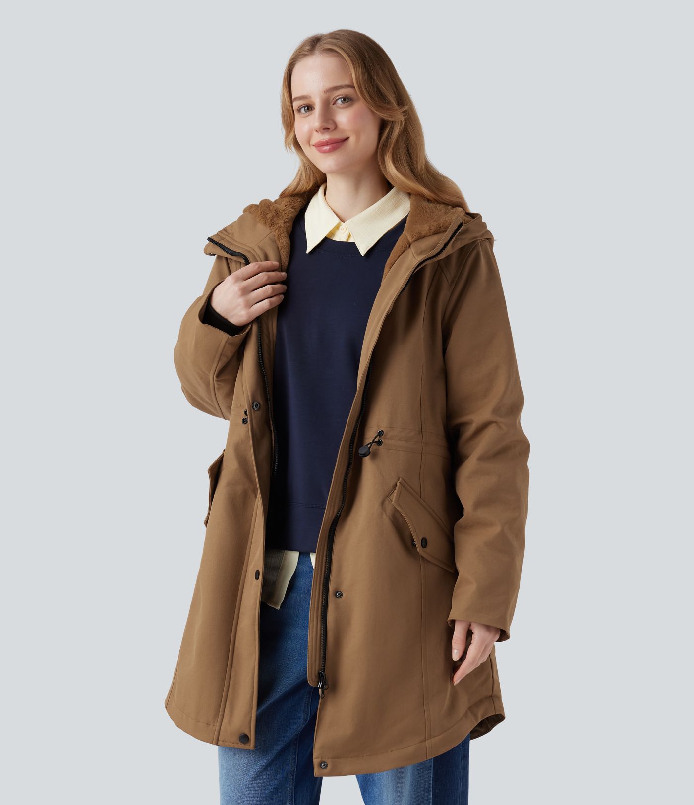 Hooded fleece parka with drawstring, sherpa lining, and pockets