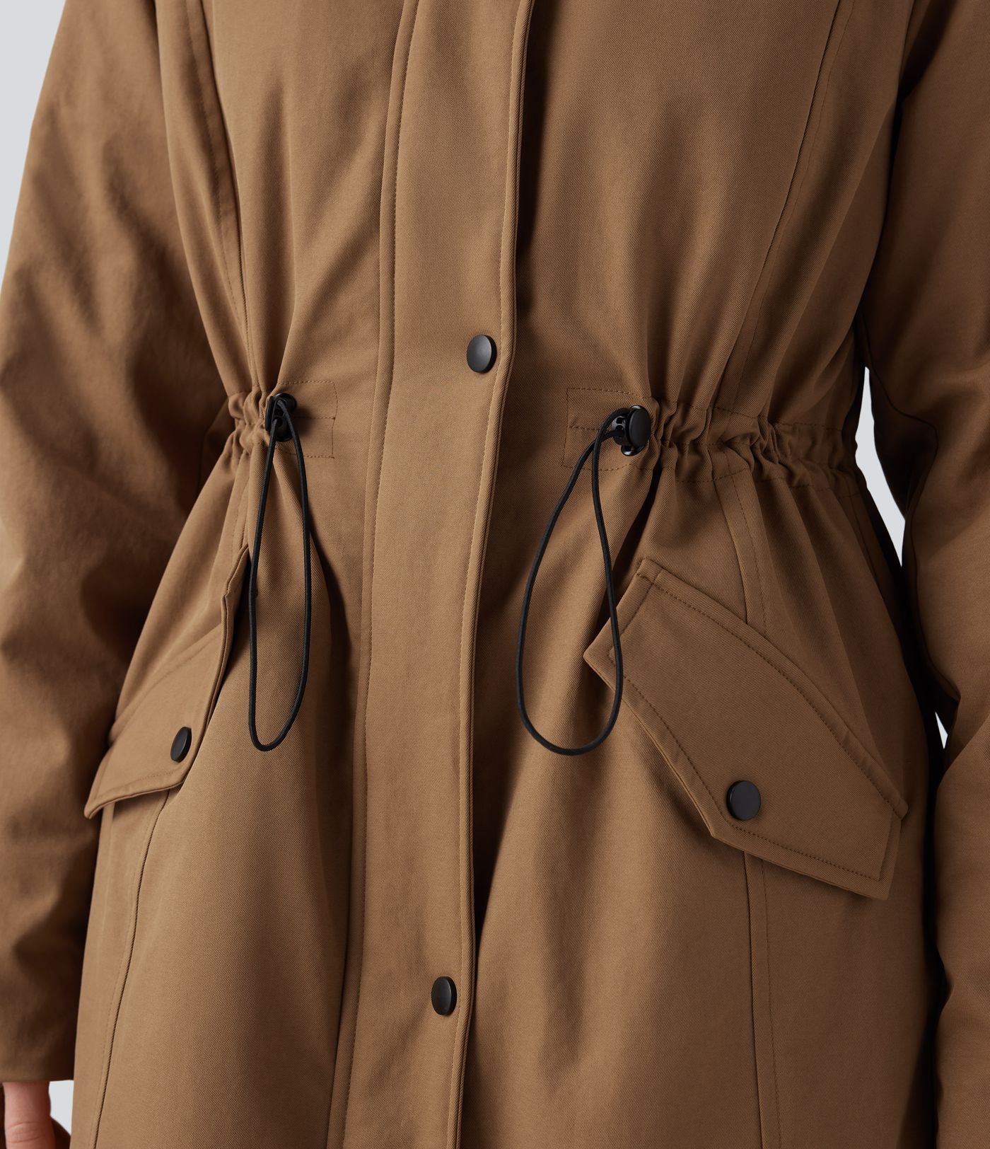 Hooded fleece parka with drawstring, sherpa lining, and pockets