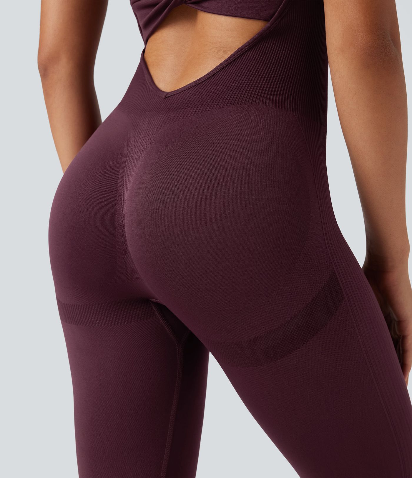 Combinaison de sport Seamless Flow sans coutures, dos torsadé et ouvert, sans manches, coupe moulante