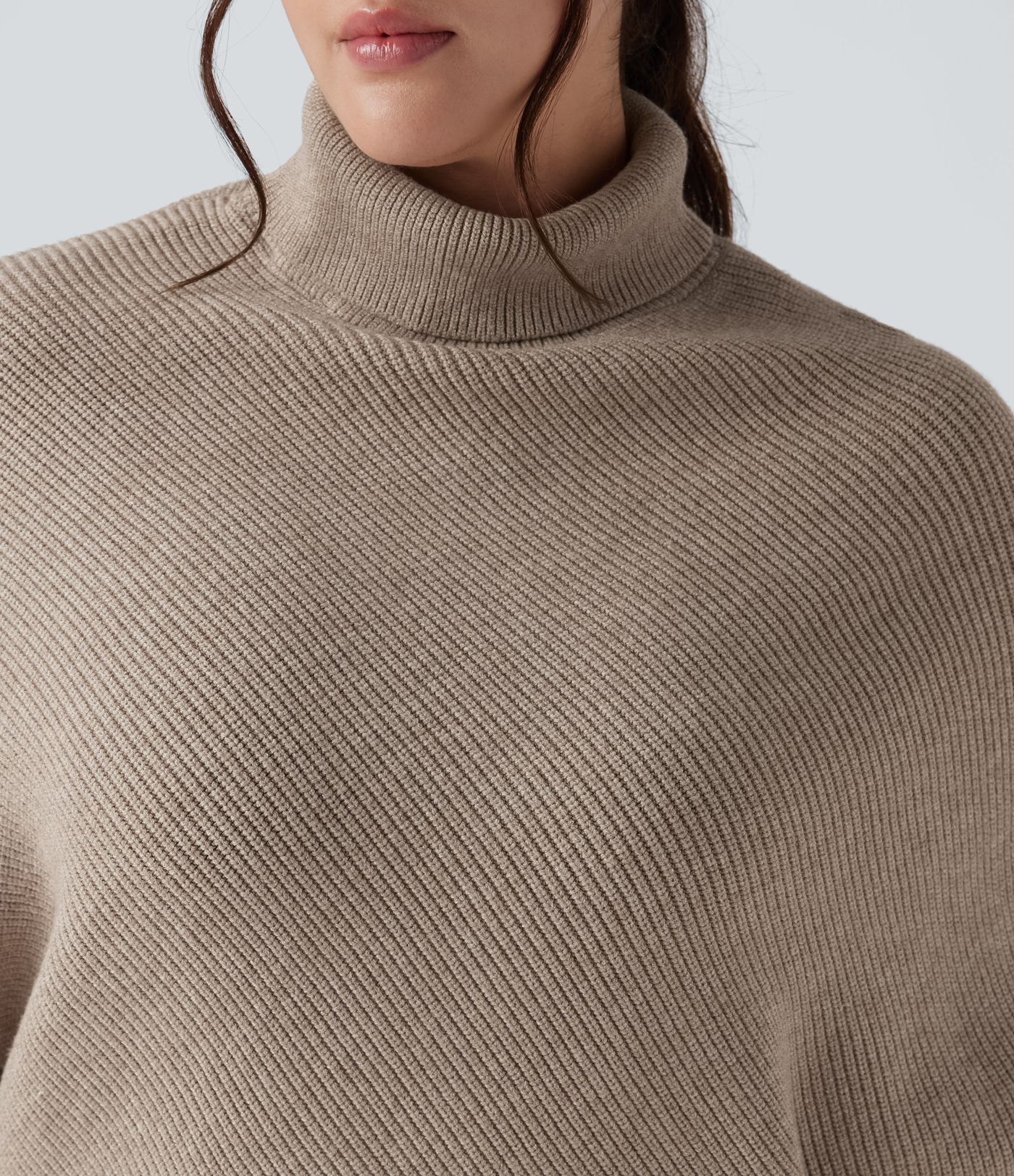 Pull grande taille col montant manches longues à ourlet asymétrique