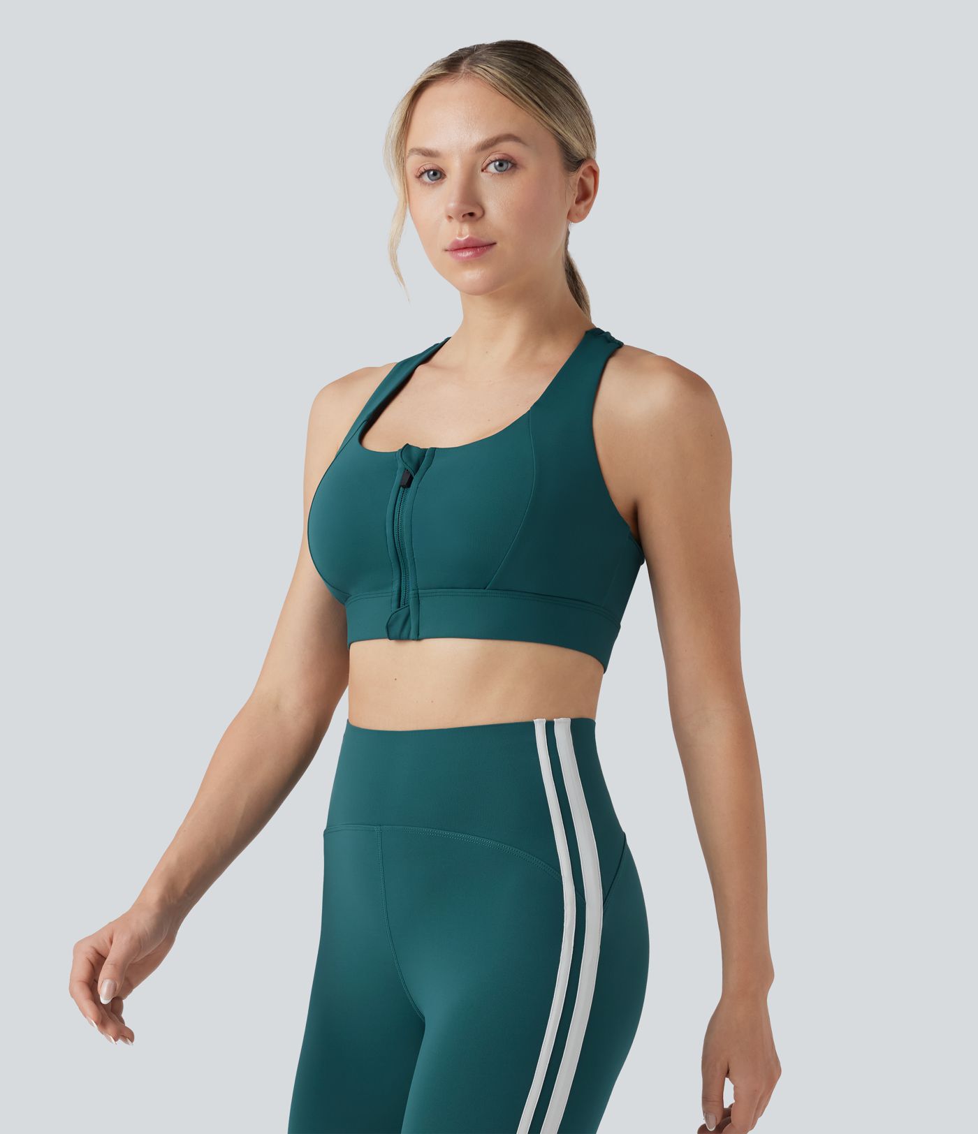 Sujetador deportivo SpeedWave™ para correr con push-up y soporte medio, espalda racerback, paneles de malla a contraste, cremallera y secado rápido.