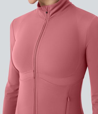 Gilet de yoga Halara UltraSculpt™ à manches longues push-up et taille haute, avec trois poches pour les pouces.