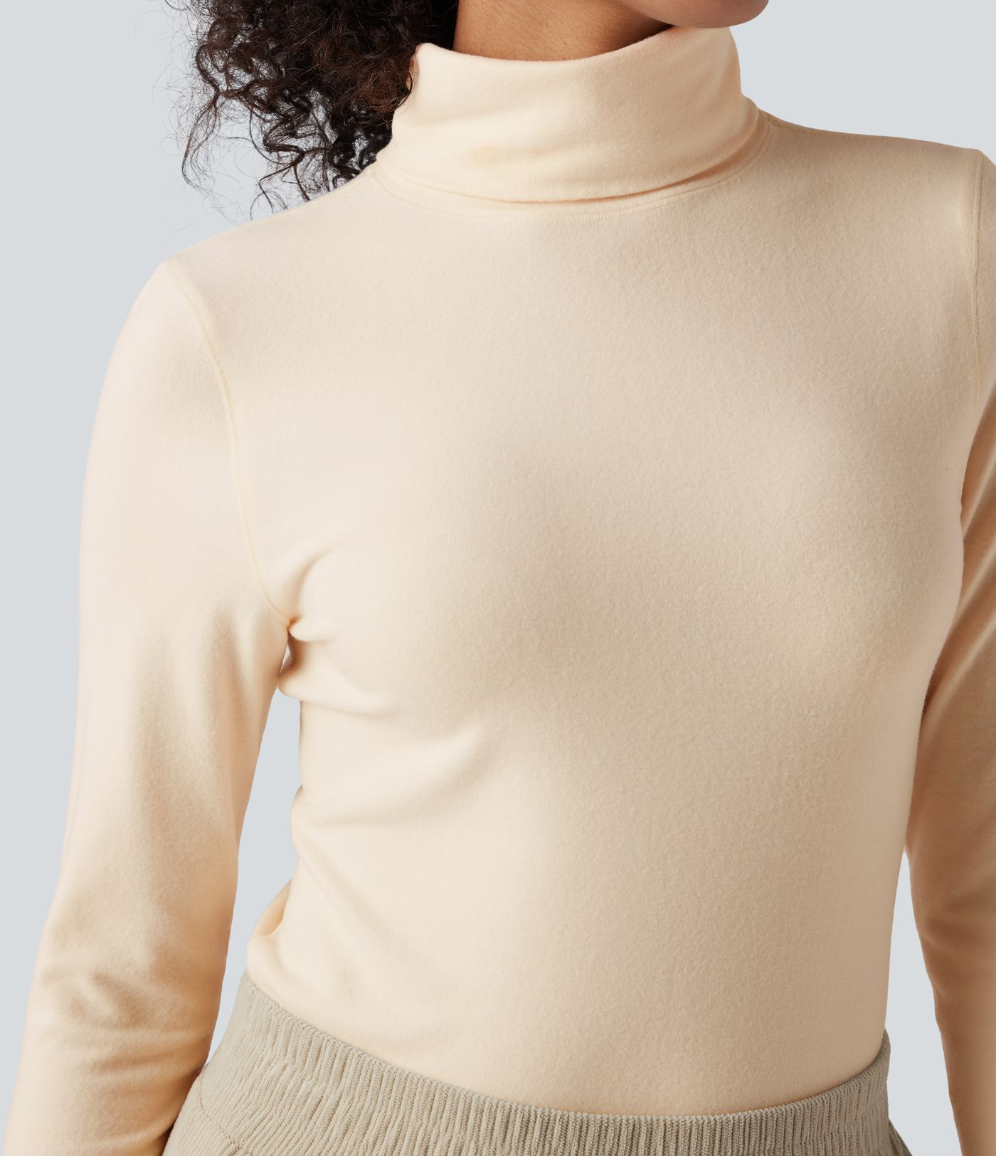 Top réchauffant col roulé manches longues avec trous pouces