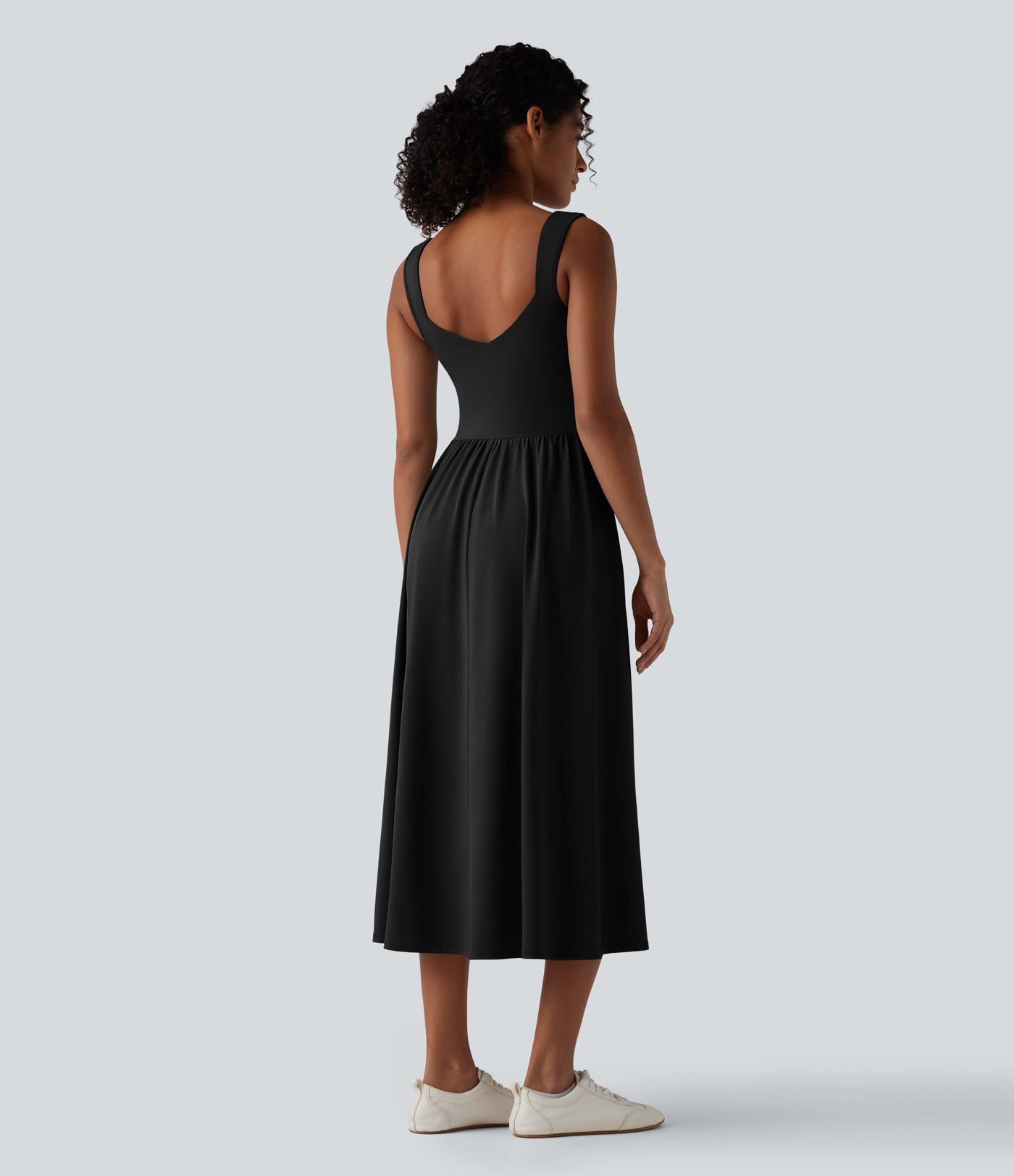 Robe décontractée midi fluide sans manches dos croisé ouvert avec poches