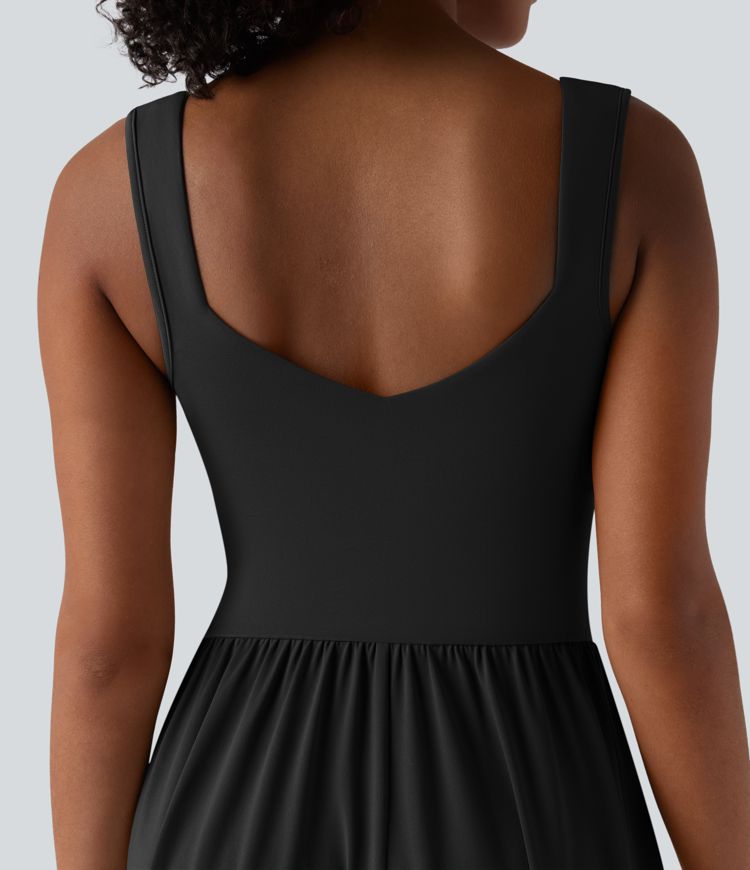 Robe décontractée midi fluide sans manches dos croisé ouvert avec poches