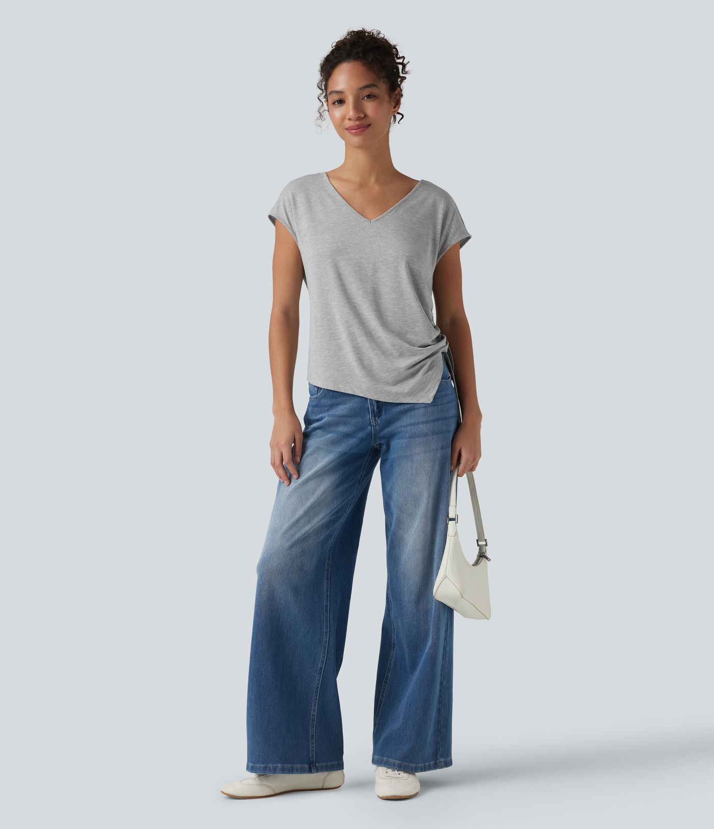 Blusa casual con escote en V, mangas murciélago, cordón y dobladillo asimétrico