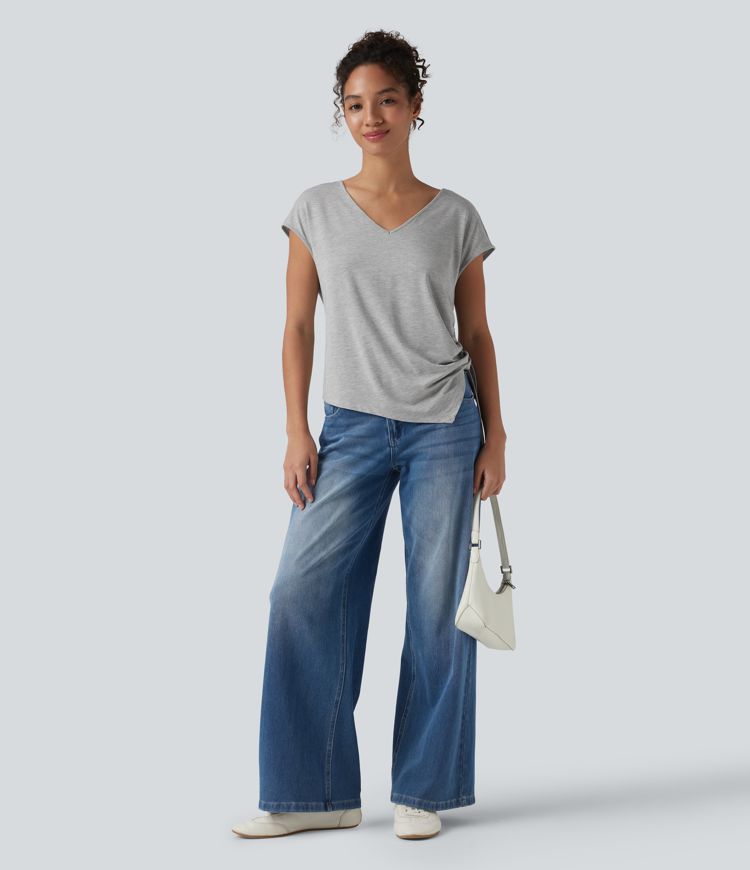 Blusa casual con escote en V, mangas murciélago, cordón y dobladillo asimétrico