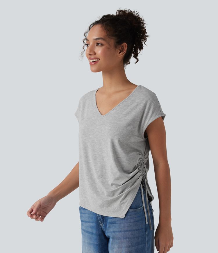 Blusa casual con escote en V, mangas murciélago, cordón y dobladillo asimétrico