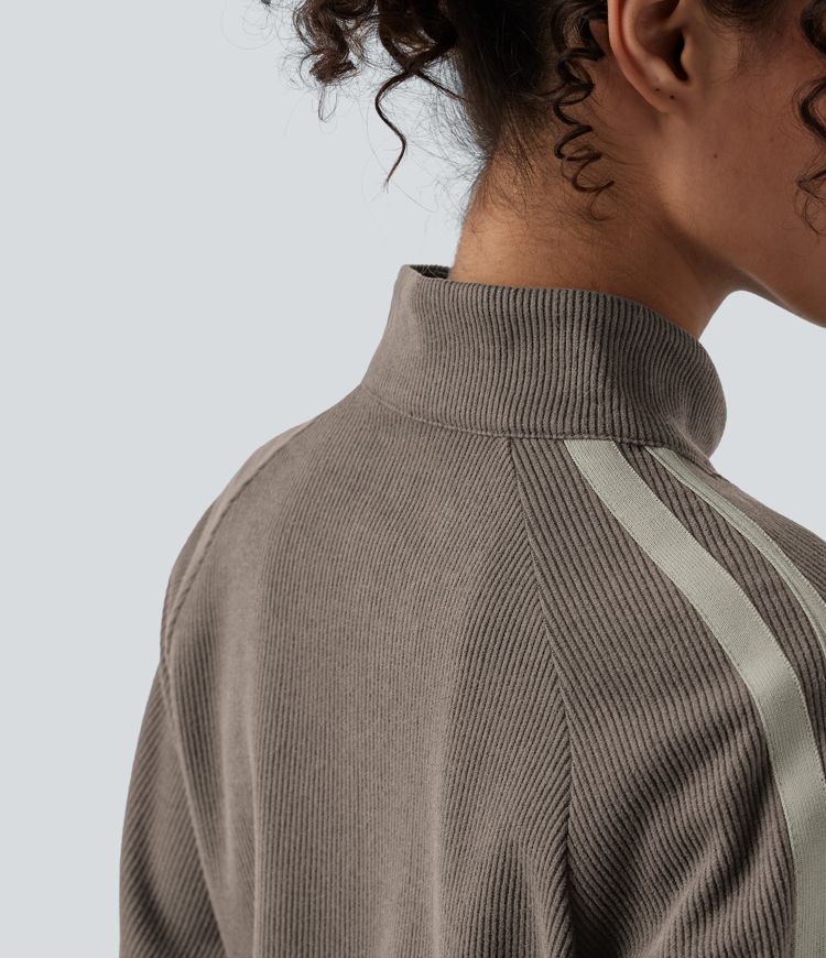 Chaqueta casual de bloques de color con cuello alto acanalado, mangas largas, cierre de cremallera y bolsillos.