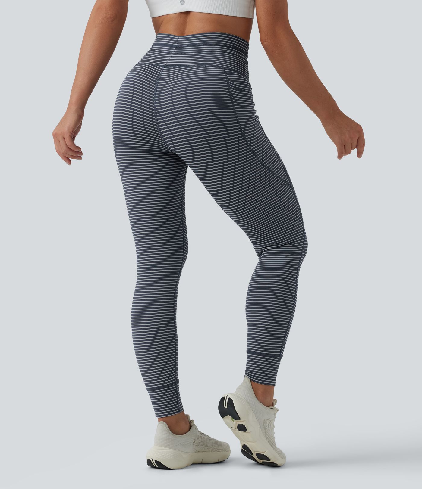 Striped yoga leggings with a high waist, side pockets and drawstring