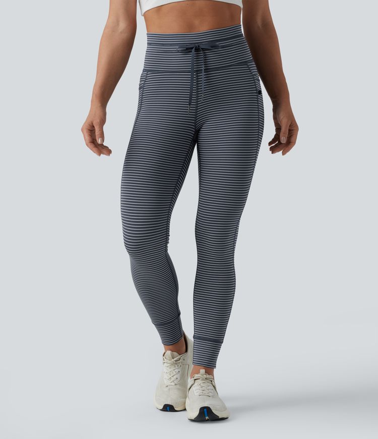 Striped yoga leggings with a high waist, side pockets and drawstring