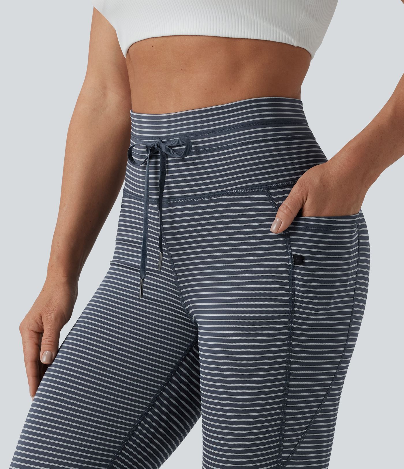 Striped yoga leggings with a high waist, side pockets and drawstring