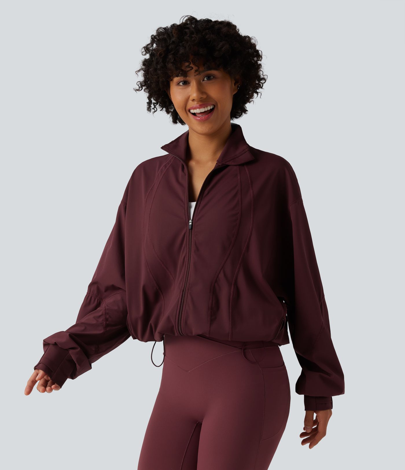 Veste d'entraînement oversize col montant avec passage de pouce, ourlet à cordon de serrage et poches