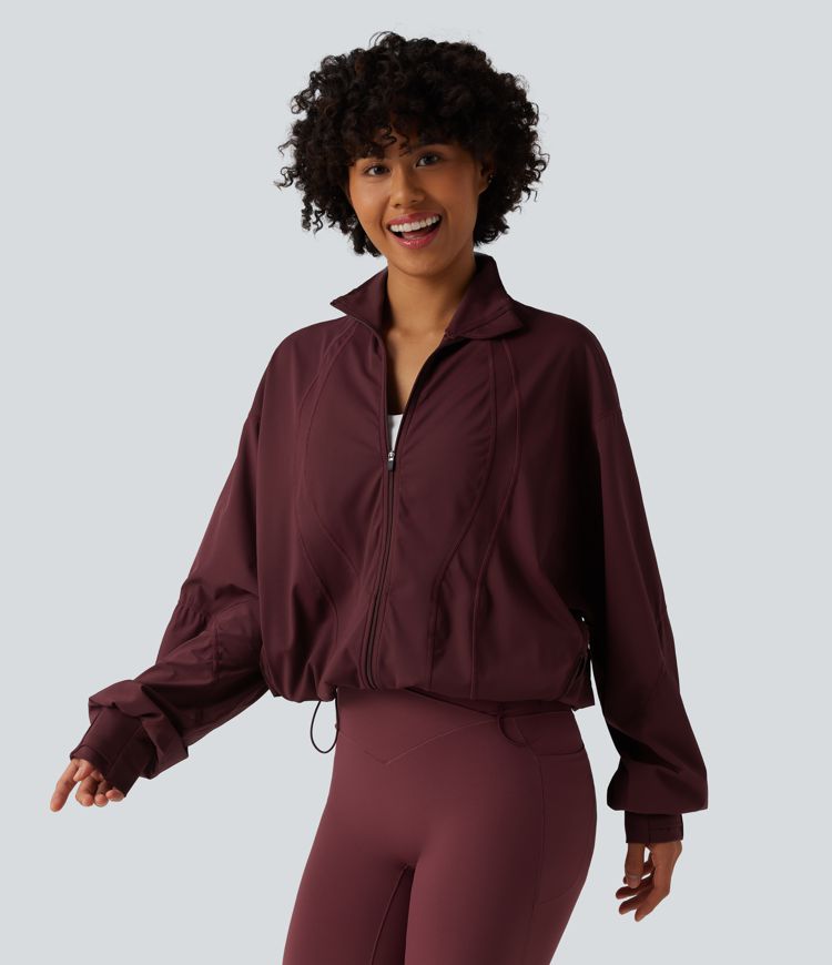 Veste d'entraînement oversize col montant avec passage de pouce, ourlet à cordon de serrage et poches