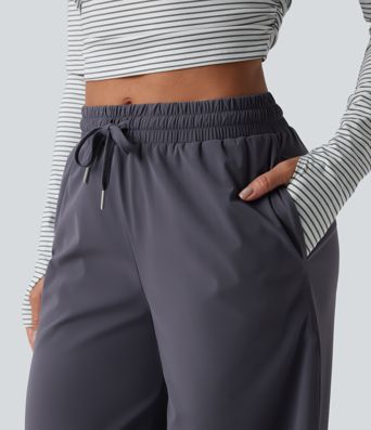 Keskmise vöökohaga jooksupüksid nööriga, sirge säärega, kiiresti kuivavad ja taskutega