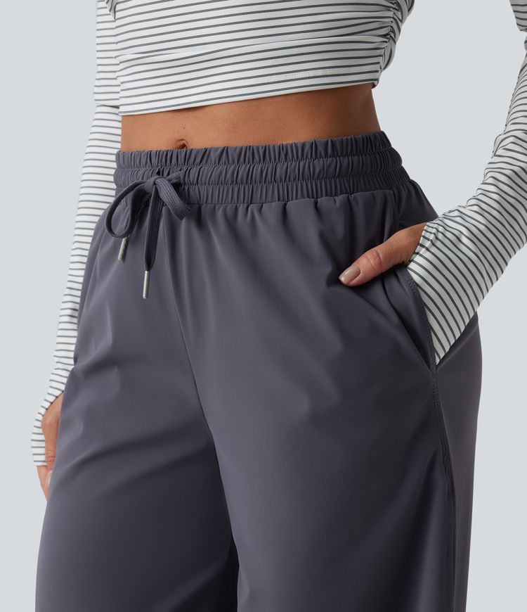 Keskmise vöökohaga jooksupüksid nööriga, sirge säärega, kiiresti kuivavad ja taskutega