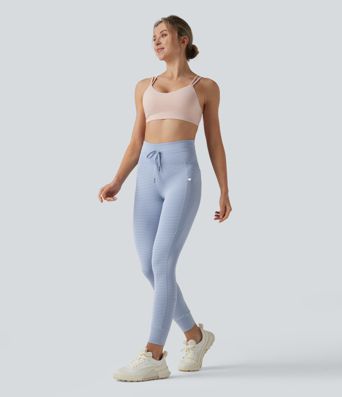 Leggings de yoga de cintura alta con rayas y bolsillos