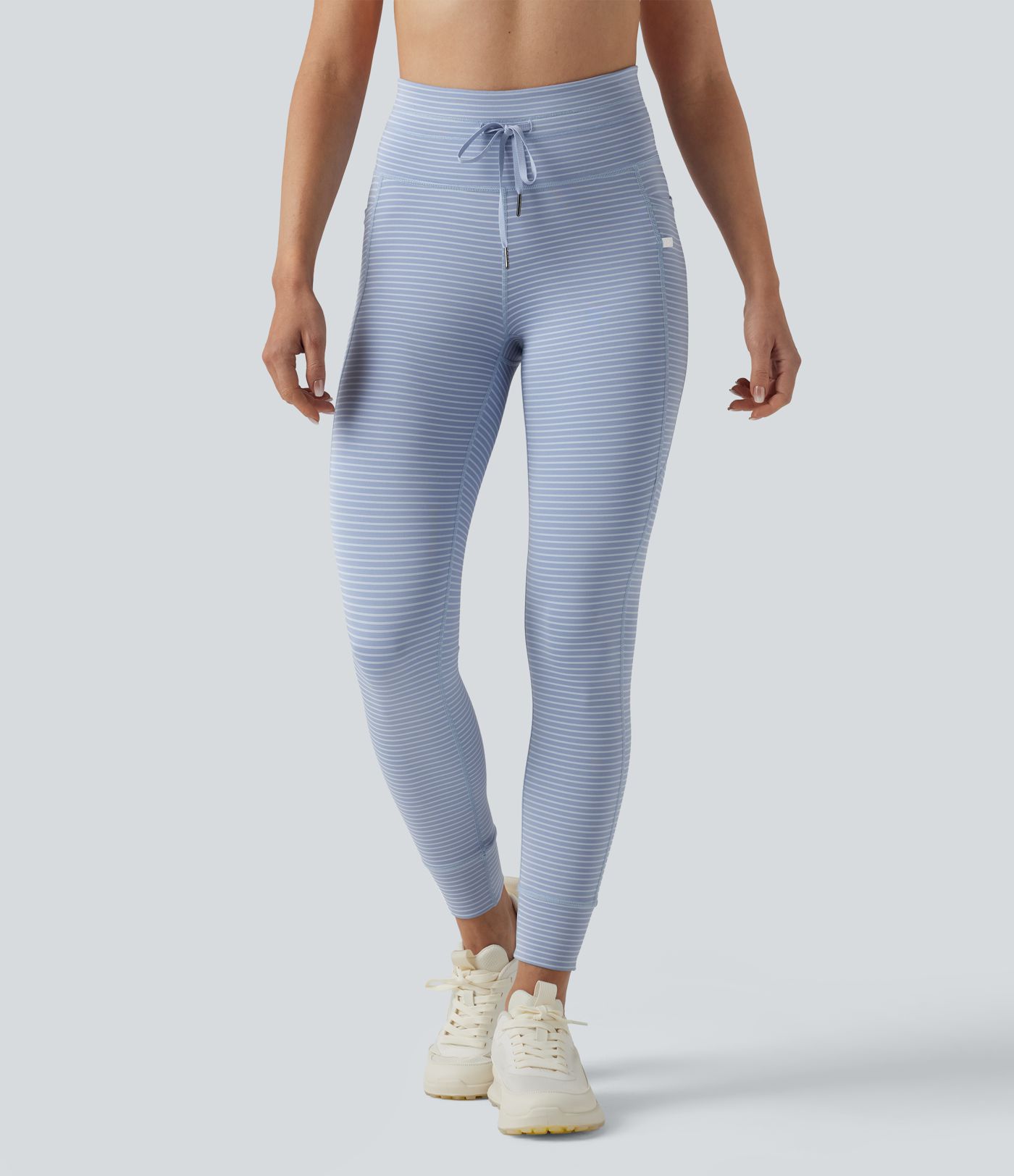 Leggings de yoga de cintura alta con rayas y bolsillos