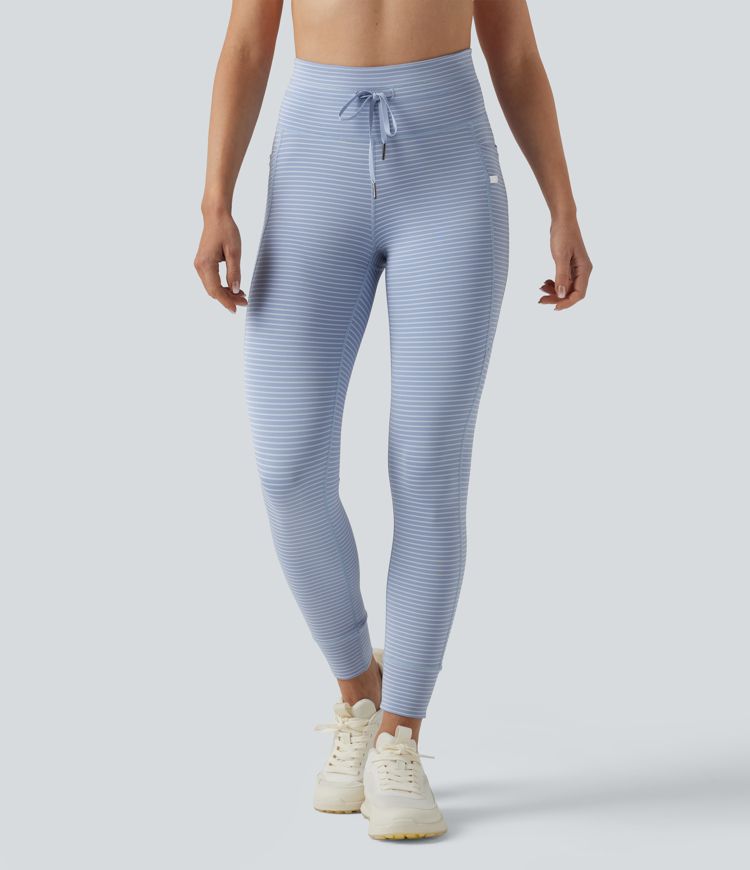 Leggings de yoga de cintura alta con rayas y bolsillos