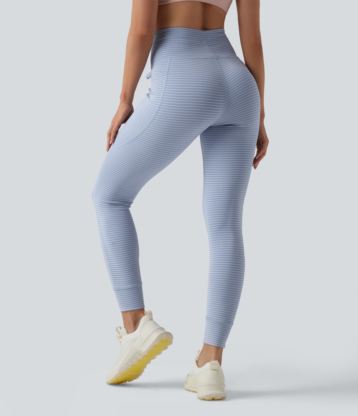 Leggings de yoga de cintura alta con rayas y bolsillos