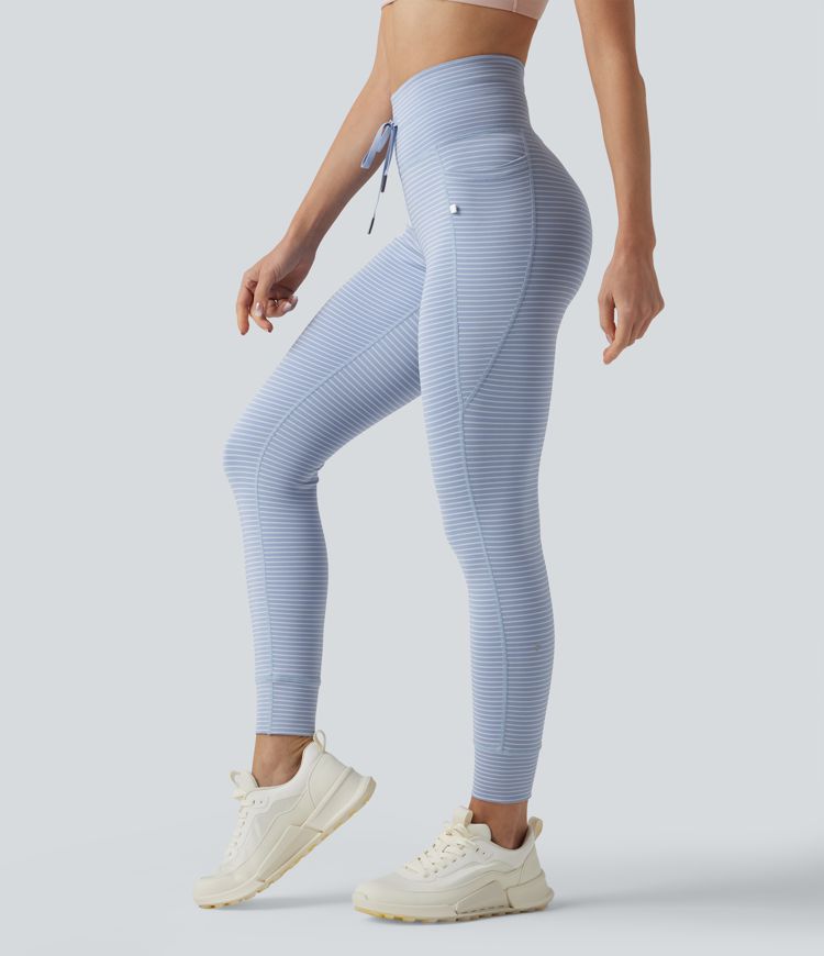 Leggings de yoga de cintura alta con rayas y bolsillos