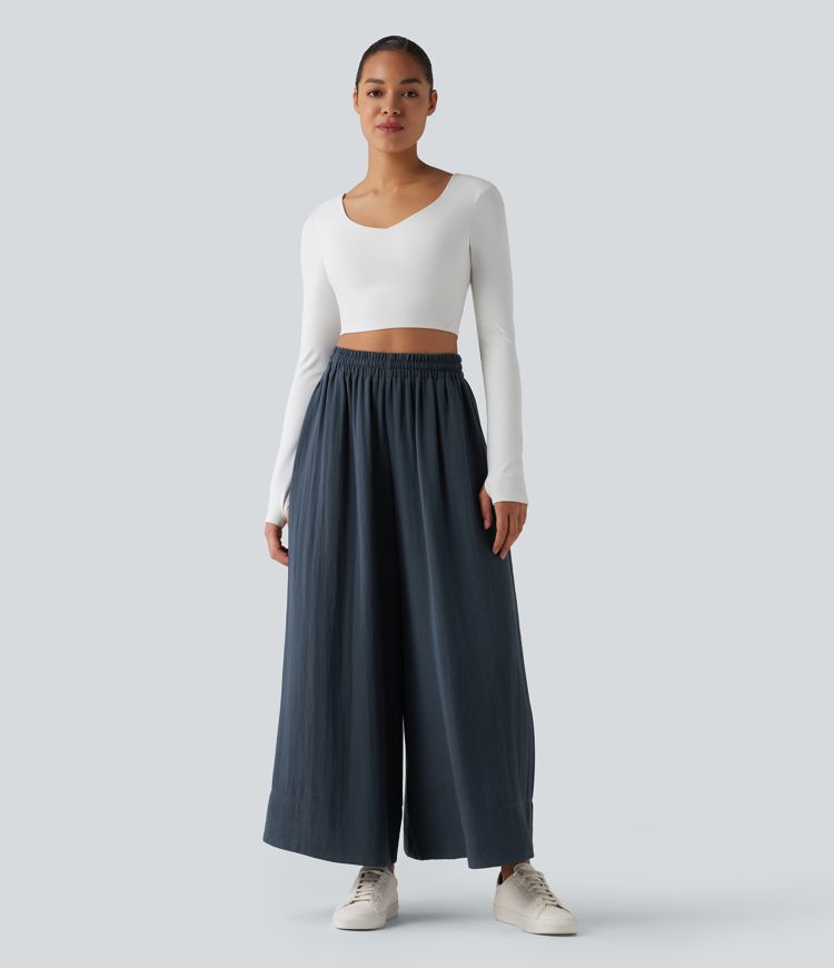 Lässige, fließende Hose mit hohem Bund, mehreren Taschen, Kordelzug und weitem Bein