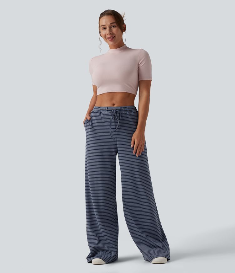 Spodnie typu baggy z wysokim stanem i ściągaczem w paski, z kieszeniami