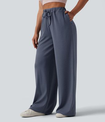 Spodnie typu baggy z wysokim stanem i ściągaczem w paski, z kieszeniami