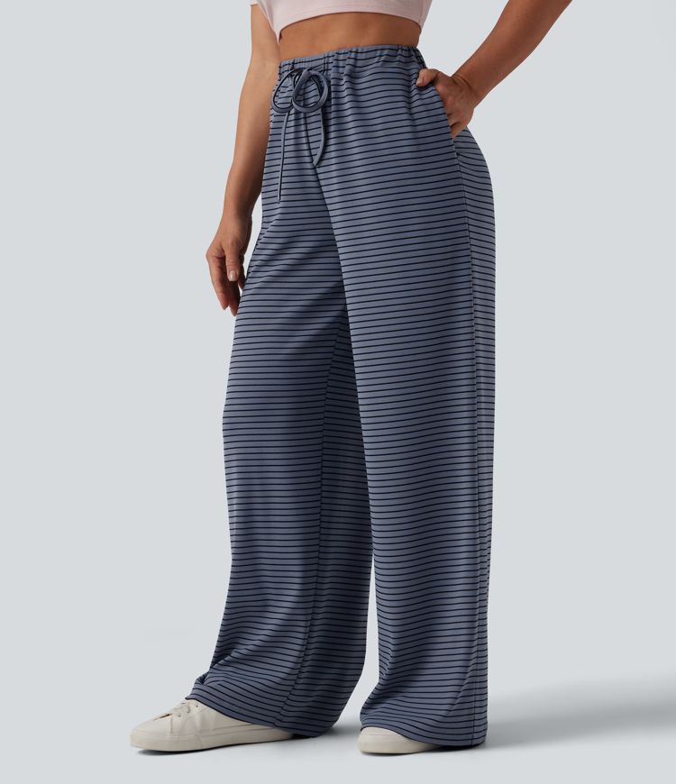 Spodnie typu baggy z wysokim stanem i ściągaczem w paski, z kieszeniami