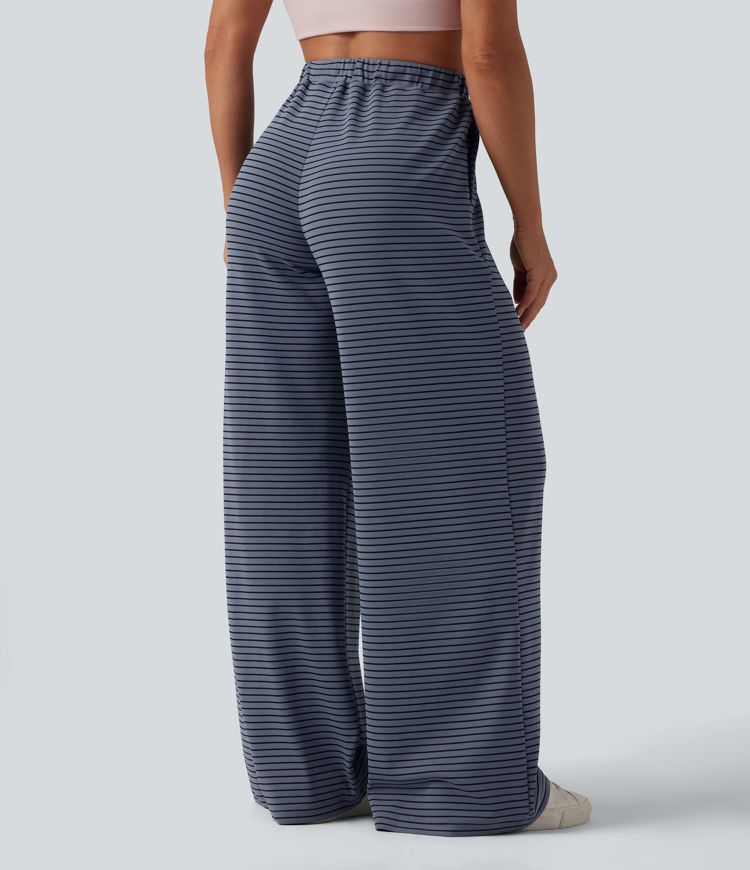 Spodnie typu baggy z wysokim stanem i ściągaczem w paski, z kieszeniami