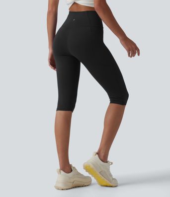SoftlyZero™ leggings de yoga de talle alto con cinturilla cruzada, estilo pedal‑pusher, con bolsillos — UPF50+