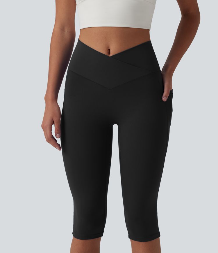 SoftlyZero™ leggings de yoga de talle alto con cinturilla cruzada, estilo pedal‑pusher, con bolsillos — UPF50+