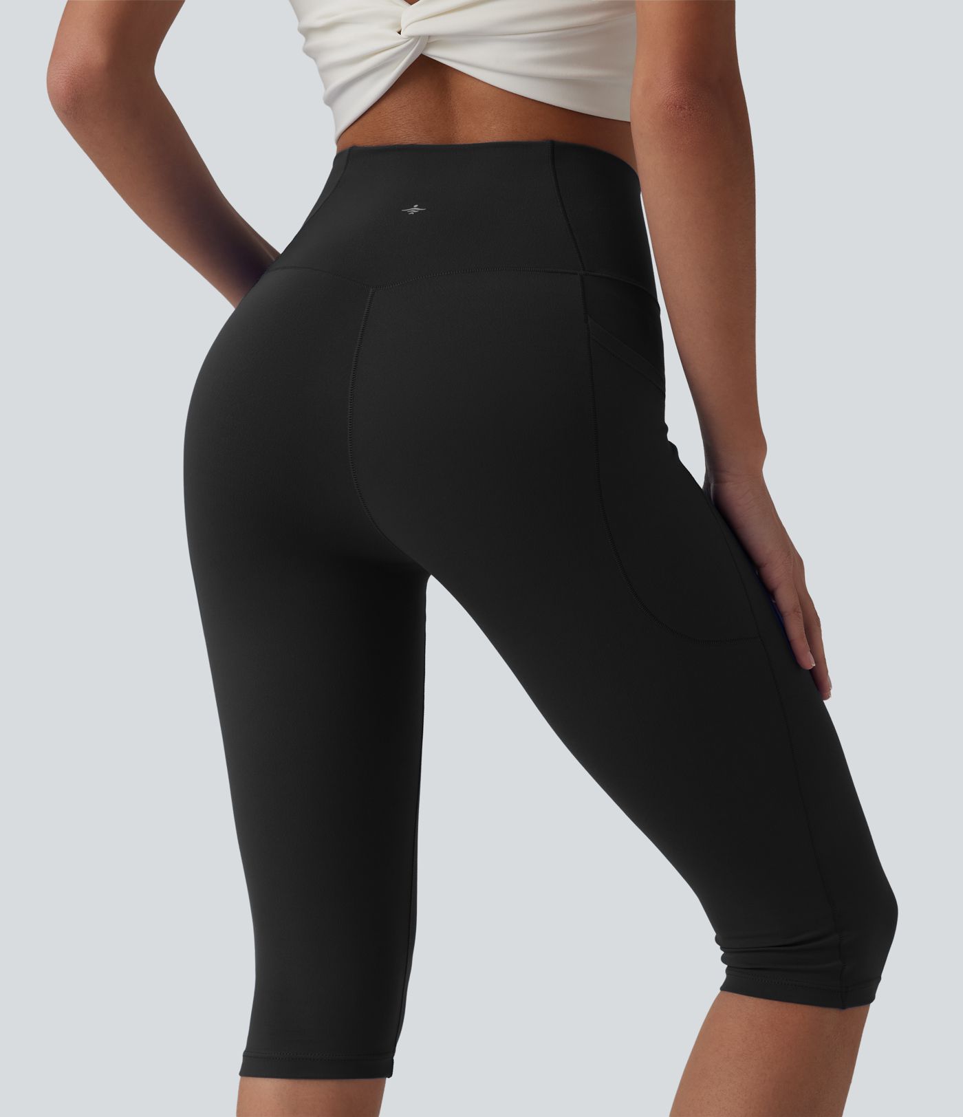 SoftlyZero™ leggings de yoga de talle alto con cinturilla cruzada, estilo pedal‑pusher, con bolsillos — UPF50+