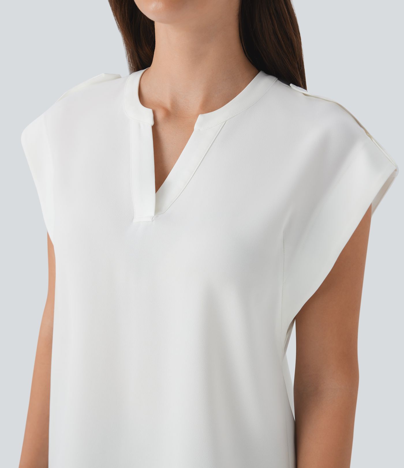 Ärmelloses Arbeitsoberteil mit V-Ausschnitt und dekorativen Knöpfen