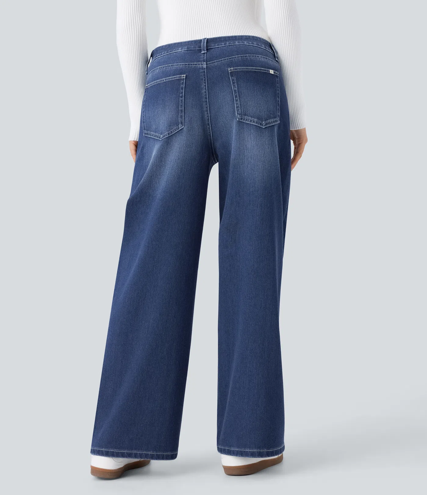 Halara Flex™ Casual, washed baggy jeans in stretch knit denim with a low waist, button, zip fly, multiple pockets and a wide leg