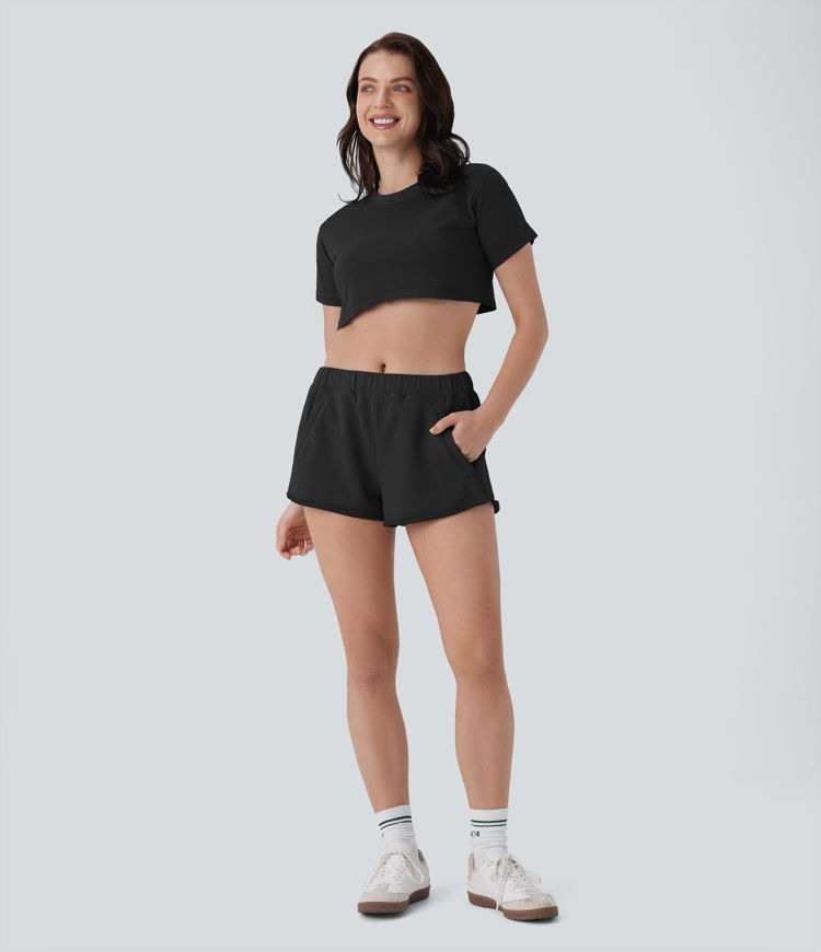 Short de yoga en coton taille mi-haute à poches zippées et ourlet brut