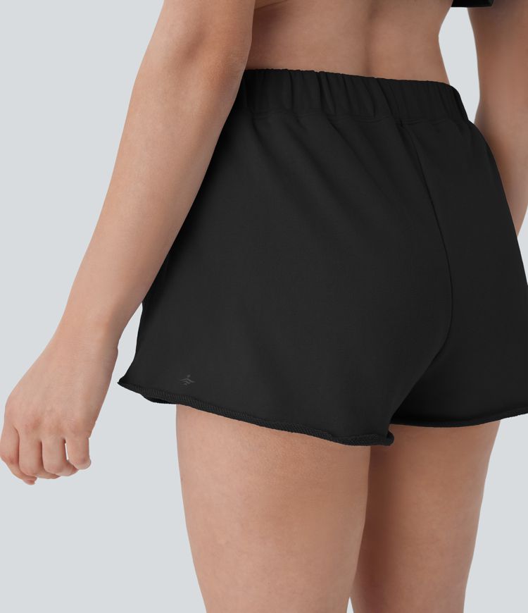 Short de yoga en coton taille mi-haute à poches zippées et ourlet brut