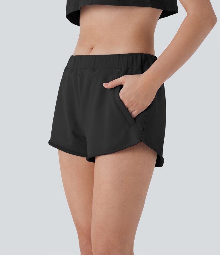 Short de yoga en coton taille mi-haute à poches zippées et ourlet brut