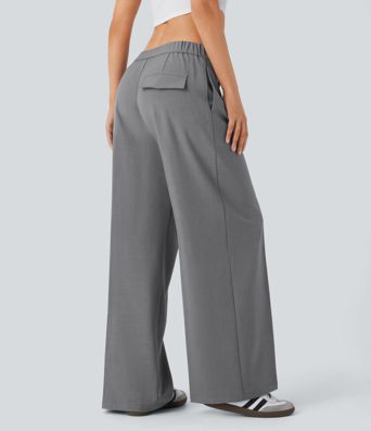 Pantalón pierna ancha bolsillo lateral cremallera tiro bajo